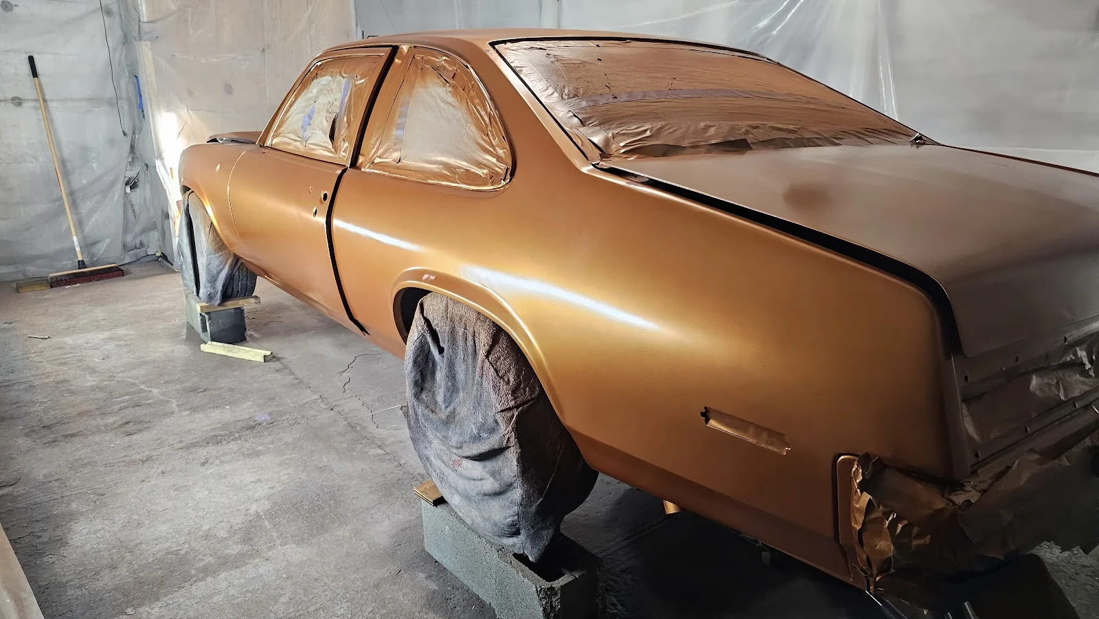 Custom paint job in the booth at Dirty Customs Paint & Body LLC, Darlington SC